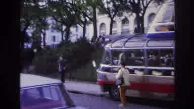 Paris France (1967): Woman Posing Next To A Sightseeing Bus As A Car Drives By