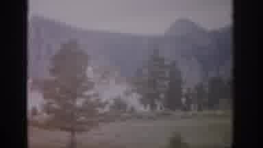 Colorado USA (1959): Car Passenger Viewing Building Helicopter Flying Over Track
