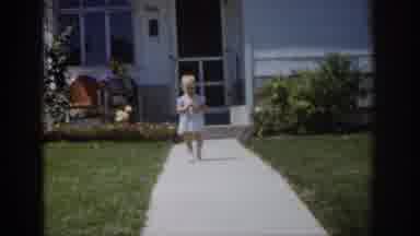 Colorado USA (1959): Child In Dress Walking Away From House As Adult Watches