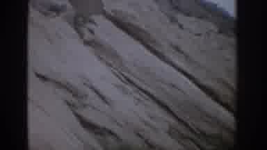 Colorado USA (1959): A Rock Wall In A Mountain Right Beside A Hiking Trail