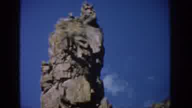Colorado USA (1959): An Eroded And Cracked Rock Formation Juts Up From The Ridge