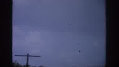 Florida USA (1959): View Of Object Flying Across Sky Above Telephone Poles And