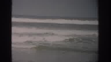 Florida USA (1959): Small Little Waves Crashing On A Beach On A Dreary Day