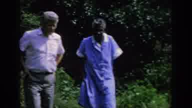 Blainsport Pennsylvania USA (1962): Man Walking With Parent That May Have Some