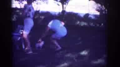 Blainsport Pennsylvania USA (1962): Woman Catching Puppy In A Tree-Lined Public