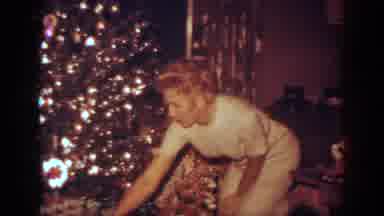 Blainsport Pennsylvania USA (1962): Woman Inspecting A Wrapped Present From