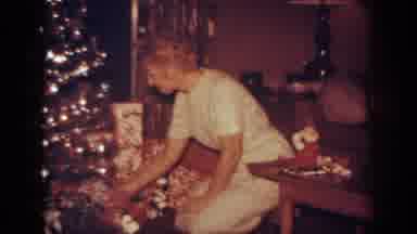 Blainsport Pennsylvania USA (1962): A Woman Kneeling By A Shimmering Christmas