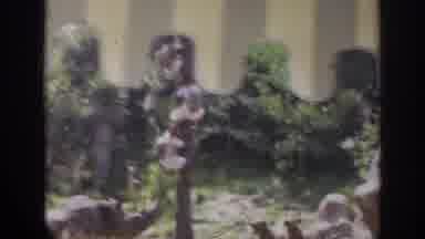Anaheim California USA (1962): A Toy Train With Kids Roaming Around A Jungle