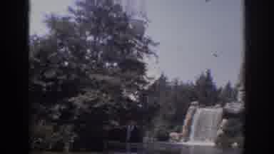 Anaheim California USA (1962): Huge Sailboat Glides Past Flowing Waterfall In