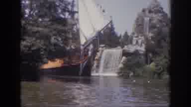 Anaheim California USA (1962): Boat Guiding Along The Water With Waterfall In The