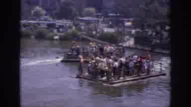 Anaheim California USA (1962): Large Amount Of People Being Transported By Rafts