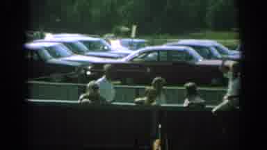 Anaheim California USA (1962): People Standing Or Sitting On Fence By Parking