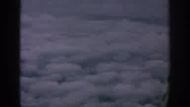 Anaheim California USA (1962): Flying Over And Through The White Puffy Clouds In A