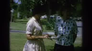 Anaheim California USA (1962): Woman Talks To Friend About Best Shoe Trends In