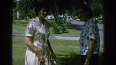 Anaheim California USA-1962: Two Women Talk To Each Other About A Pair Of High