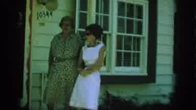 Anaheim California USA (1962): Two Women Talking In Front Of A House