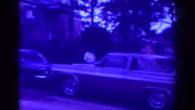 Raleigh North Carolina USA (1962): A Woman Stands Next To A Car And Looks Around