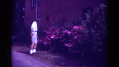 Raleigh North Carolina USA (1962): Boy Outside Near Flower Bush