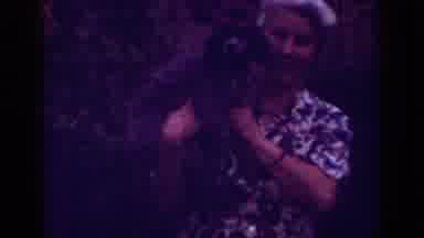 Raleigh North Carolina USA (1962): Woman With A Dog Caught In Her Arms