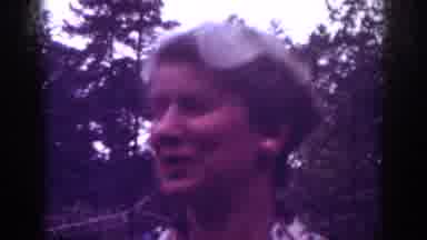 Raleigh North Carolina USA (1962): Adult Blonde Woman Wearing Big Earrings Talking