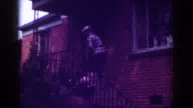 Raleigh North Carolina USA (1962): Elderly Lady Climbing Steps And Lifting Dog To