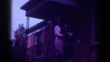 Raleigh North Carolina USA (1962): Well Dressed Woman On Porch Kissing Small Dog
