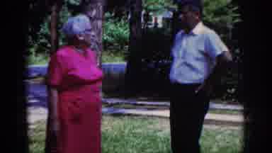 Raleigh North Carolina USA (1962): A Man And Woman Stand And Look At Each Other As