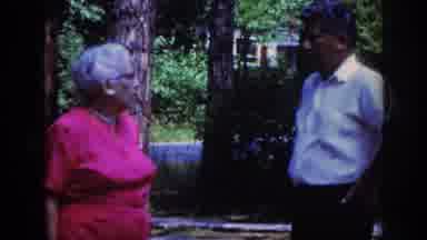 Raleigh North Carolina USA (1962): Old Lady In Pink Talking To Man
