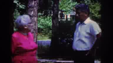 Raleigh North Carolina USA (1962): Man And Woman Talking In A Yard