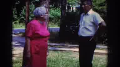 Raleigh North Carolina USA (1962): People Talking In An Outdoor Setting Next To A