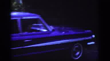 Raleigh North Carolina USA (1962): Car Driving Down Road While Photographer Takes