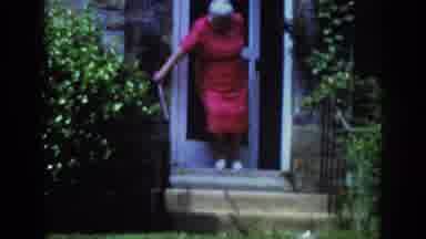 Raleigh North Carolina USA (1962): Old Lady Climbs Down Stairs