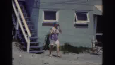 Raleigh North Carolina USA (1962): Woman Walking Out Of Her House In The 80s To Go