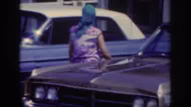 Raleigh North Carolina USA (1962): Running Between Cars