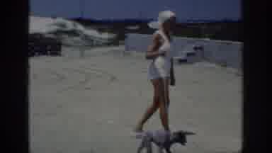 Raleigh North Carolina USA (1962): Woman Walks Her Dogs On The Terrace Of Her