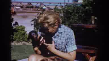 Yorba Linda California USA (1962): Women Loving On Her Dogs