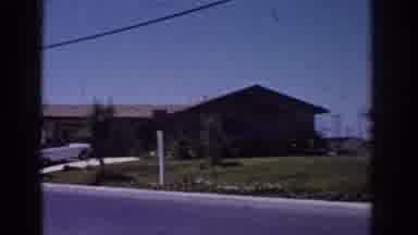 YORBA LINDA CALIFORNIA USA-1962: Panning Around The Exterior Of A Mid-Century Home With Classic Car