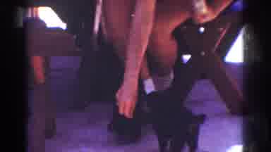 Yorba Linda California USA (1962): Person Playing With Two Black Puppies With Food