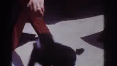 Yorba Linda California USA (1962): Woman Holds Small Black Puppy, Feeds Dog Treat