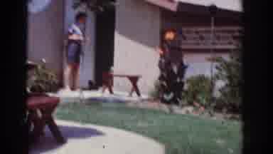 Yorba Linda California USA (1962): Dog Runs Out Of House While Woman Stands At