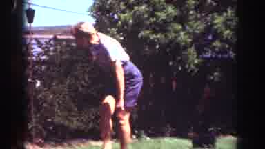Yorba Linda California USA (1962): Woman Outside Tosses Something In A Bush And