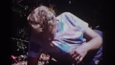 Yorba Linda California USA (1962): Woman In Multicolored Shirt Plays With Little