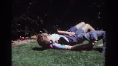 Yorba Linda California USA (1962): Woman Laying On Ground Outdoor Playing With