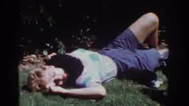 Yorba Linda California USA (1962): Woman In Shorts Lying On Lawn With Puppies And