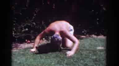 Yorba Linda California USA (1962): A Shirtless Man Is Playing With Two Small