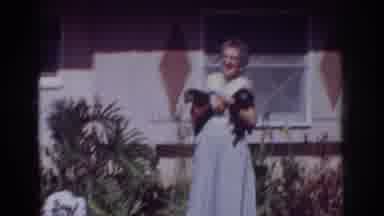 Yorba Linda California USA (1962): Lady Holding Two Dogs