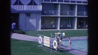 Memphis Tennessee USA (1963): Family Swimming In A Pool At A Hotel With Their Pet
