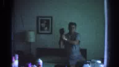 Memphis Tennessee USA (1963): Dog Watches Front Door, Man Records Self In Mirror,
