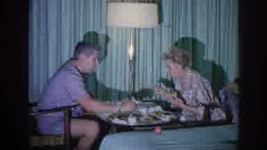 Memphis Tennessee USA (1963): Two People Eating From A Tray And Feeding Dog