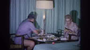 Memphis Tennessee USA (1963): Family Sitting Down To Eat While The Woman Is